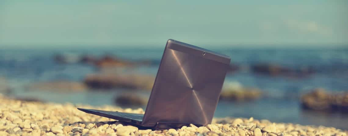 laptop on a beach e1449162421580